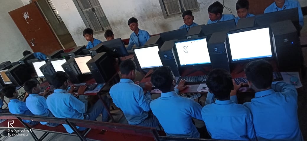 Computer lab at Blue Ink School International — one computer per student